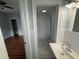 Ensuite bathroom offering a shower, vessel sink and marble tiling at 1328 Edgewater Beach Dr, Lakeland, FL 33805