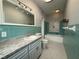 Bathroom featuring updated vanity, lighting, and tile in a retro design at 1328 Edgewater Beach Dr, Lakeland, FL 33805