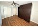 This bedroom has a closet, Murphy bed, and a ceiling fan at 1328 Edgewater Beach Dr, Lakeland, FL 33805