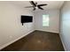 Bedroom features a ceiling fan, large window, and outlets for wall mount tv at 1328 Edgewater Beach Dr, Lakeland, FL 33805