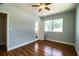 Bedroom with hardwood floors, ceiling fan, and ensuite bathroom at 1328 Edgewater Beach Dr, Lakeland, FL 33805