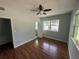 Comfortable bedroom featuring light gray walls, laminate flooring, and a modern ceiling fan at 1328 Edgewater Beach Dr, Lakeland, FL 33805