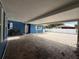 Spacious brick-paved carport adjacent to a blue home, providing ample covered parking at 1328 Edgewater Beach Dr, Lakeland, FL 33805