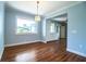 Dining room with hardwood floors, neutral paint, and view to the kitchen at 1328 Edgewater Beach Dr, Lakeland, FL 33805