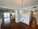 Dining room with views of the updated kitchen and outdoor patio with pool and lake at 1328 Edgewater Beach Dr, Lakeland, FL 33805