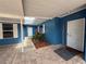 Inviting entrance featuring a cozy seating area, complemented by brick flooring at 1328 Edgewater Beach Dr, Lakeland, FL 33805