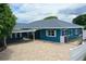 Stunning single-story home with an expansive brick driveway and a convenient covered parking area at 1328 Edgewater Beach Dr, Lakeland, FL 33805
