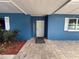 Attractive front entrance with a secure screen door and a well-maintained brick walkway at 1328 Edgewater Beach Dr, Lakeland, FL 33805