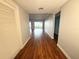 Bright hallway featuring laminate floors, leading to a large living area with water views at 1328 Edgewater Beach Dr, Lakeland, FL 33805