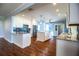 Renovated kitchen featuring stainless steel appliances and granite countertops, with a view into Gathering room at 1328 Edgewater Beach Dr, Lakeland, FL 33805