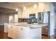 Bright kitchen features stainless steel appliances, granite countertops, and center island at 1328 Edgewater Beach Dr, Lakeland, FL 33805