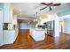 Bright kitchen features stainless steel appliances and granite countertops, open to the living area at 1328 Edgewater Beach Dr, Lakeland, FL 33805