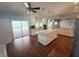 Expansive kitchen with island, stainless appliances and views of the outdoor pool and patio at 1328 Edgewater Beach Dr, Lakeland, FL 33805