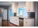 Bright kitchen featuring white cabinets, stainless steel appliances, and sleek subway tile backsplash at 1328 Edgewater Beach Dr, Lakeland, FL 33805