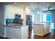 Renovated kitchen featuring stainless steel appliances and granite countertops, with an island and breakfast bar at 1328 Edgewater Beach Dr, Lakeland, FL 33805