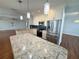 Modern kitchen featuring stainless steel appliances, white cabinetry, and a large island at 1328 Edgewater Beach Dr, Lakeland, FL 33805