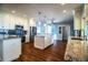 Bright kitchen features stainless steel appliances and granite countertops, plus island and seating at 1328 Edgewater Beach Dr, Lakeland, FL 33805