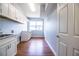 Spacious laundry room with ample cabinet space, sink and granite countertops at 1328 Edgewater Beach Dr, Lakeland, FL 33805