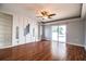 Living room with built-in shelving and sliding glass doors out to the pool area at 1328 Edgewater Beach Dr, Lakeland, FL 33805