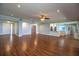 Open-concept living room with hardwood floors and recessed lights at 1328 Edgewater Beach Dr, Lakeland, FL 33805