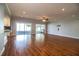 Open living room with hardwood floors, recessed lights, and sliding glass doors to the screened lanai at 1328 Edgewater Beach Dr, Lakeland, FL 33805