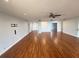 Spacious living room boasts stylish hardwood flooring, and an open concept layout at 1328 Edgewater Beach Dr, Lakeland, FL 33805