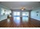 Spacious living room with hardwood floors, recessed lighting, and sliding glass doors at 1328 Edgewater Beach Dr, Lakeland, FL 33805