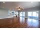 Open-concept living room with hardwood floors, recessed lighting, and a view of the backyard at 1328 Edgewater Beach Dr, Lakeland, FL 33805