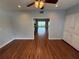 Living room with hardwood floors, recessed lighting and view into a sunroom at 1328 Edgewater Beach Dr, Lakeland, FL 33805