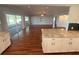 Open concept living room with sliding glass doors and seamless access to the kitchen at 1328 Edgewater Beach Dr, Lakeland, FL 33805