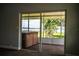 Screened-in brick patio with a hot tub and a view of the lake at 1328 Edgewater Beach Dr, Lakeland, FL 33805