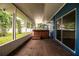 Covered patio features a relaxing hot tub, offering a private outdoor retreat at 1328 Edgewater Beach Dr, Lakeland, FL 33805