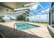 Screened pool with brick pavers and scenic lake views for ultimate relaxation at 1328 Edgewater Beach Dr, Lakeland, FL 33805