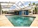 Inviting pool surrounded by a screened enclosure and lush greenery for privacy and comfort at 1328 Edgewater Beach Dr, Lakeland, FL 33805