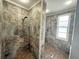 A shower with a window and beautiful tilework at 1328 Edgewater Beach Dr, Lakeland, FL 33805