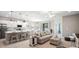 Open-concept living space featuring a kitchen with quartz countertops, dining area, and living room at 1368 Melrose St, Lake Alfred, FL 33850