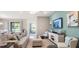 Inviting living room with comfortable seating, neutral decor, and plenty of natural light at 1368 Melrose St, Lake Alfred, FL 33850