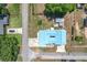 Aerial view of a home showcasing a large lot with lush green space and mature trees at 1405 Clinton St, Bartow, FL 33830