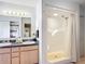 Bathroom with double sink vanity, walk in shower, and tile flooring at 1405 Clinton St, Bartow, FL 33830