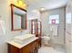 Bathroom with vessel sink, modern vanity, and walk-in shower at 1405 Clinton St, Bartow, FL 33830