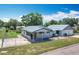 Charming single-story home with a metal roof, fenced yard and screened porch at 1405 Clinton St, Bartow, FL 33830