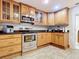 Kitchen with stainless steel appliances, granite countertops, and custom cabinets at 1405 Clinton St, Bartow, FL 33830