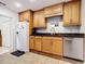 Kitchen features stainless steel appliances and wood cabinets at 1405 Clinton St, Bartow, FL 33830