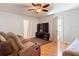 Comfortable living room with wood flooring, ceiling fan and tv at 1405 Clinton St, Bartow, FL 33830