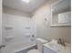 Well-lit bathroom with a shower-tub combination and a modern vanity with a framed mirror at 1507 Holly Rd, Lakeland, FL 33801