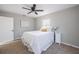 Cozy bedroom with ceiling fan, neutral walls, and comfortable carpet at 1507 Holly Rd, Lakeland, FL 33801