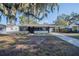 Inviting home featuring an eye-catching exterior with charming details and a well-maintained yard at 1507 Holly Rd, Lakeland, FL 33801