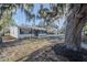 Delightful home with a fresh exterior, complemented by mature trees and an inviting curb appeal at 1507 Holly Rd, Lakeland, FL 33801
