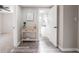Hallway featuring stylish vinyl flooring and a peek into a bathroom at 1507 Holly Rd, Lakeland, FL 33801