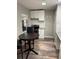 Efficient kitchen featuring white cabinets, granite countertops, and an electric range at 1507 Holly Rd, Lakeland, FL 33801